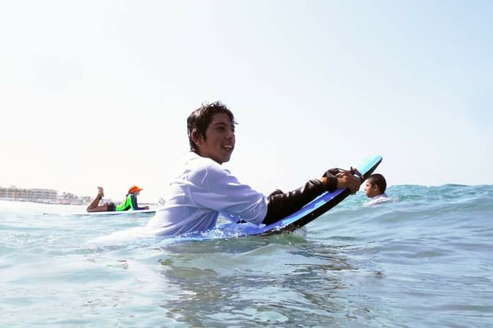 Pedro Sanchez Jr. learns how to catch a wave through Outdoor Outreach, an organization that connects inner-city San Diegan youth with nature. / Photo courtesy of Pedro Sanchez Jr.
