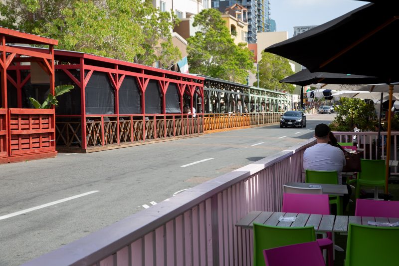 Outdoor dining structures set up by restaurants on India St. in Little Italy.