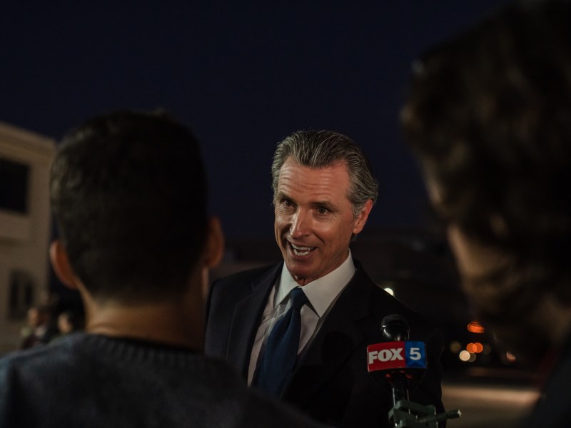 Gov. Gavin Newsom speaks to members of the media at the Marine Corps Air Station Miramar on Nov. 3, 2022.