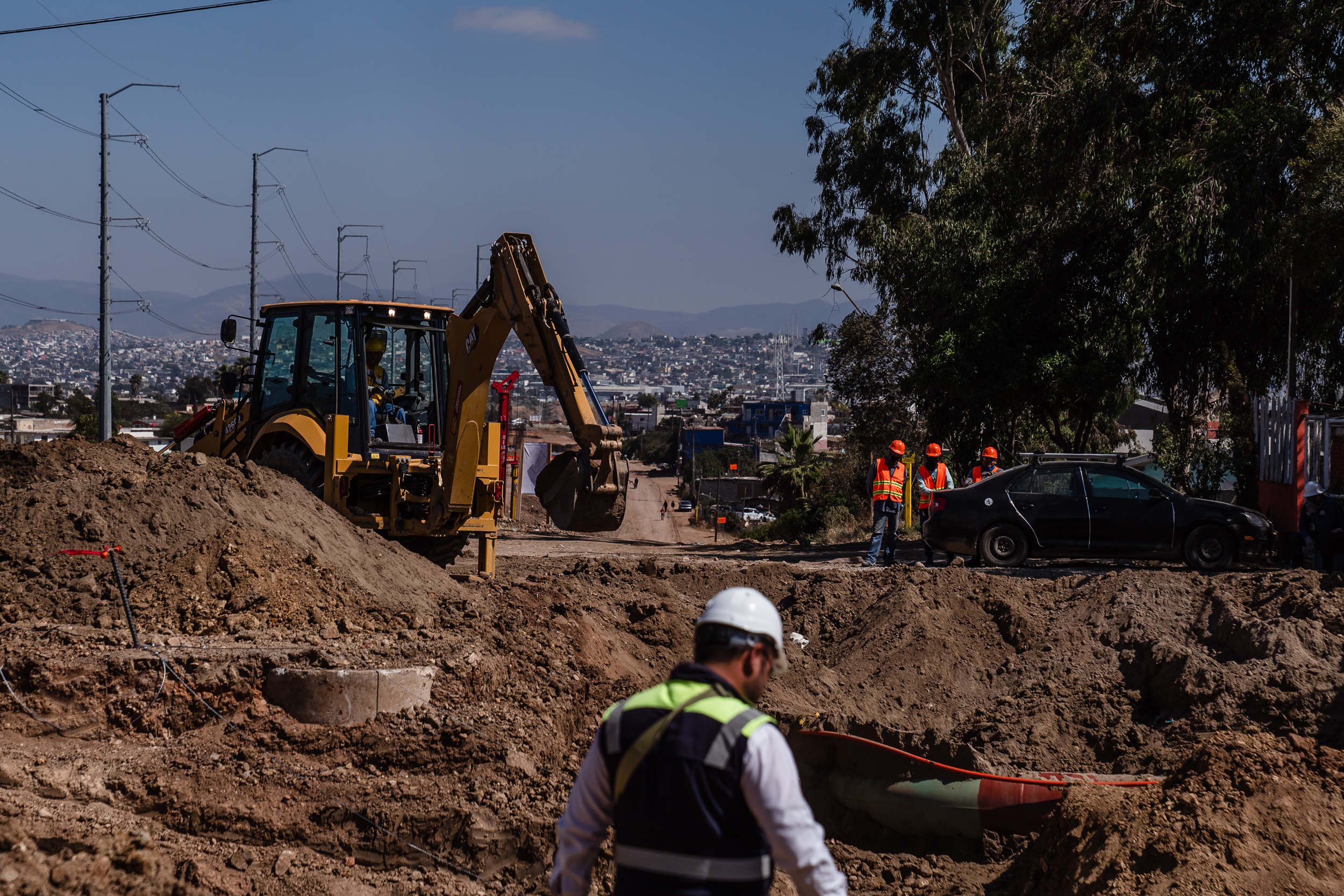 Men prepping for the gas line in Tijuana for the SR II Otay Mesa East Port of Entry on June 14, 2023.