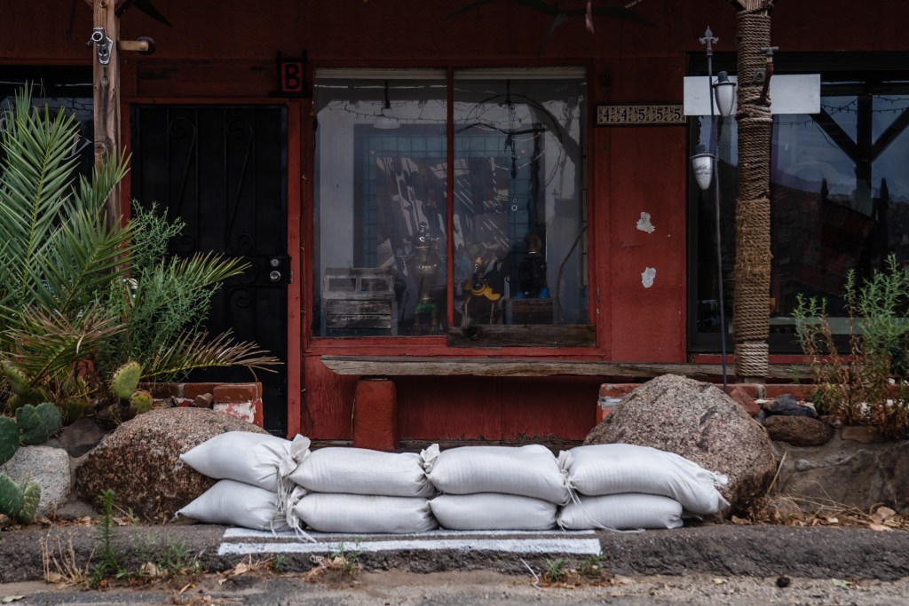 Sandbags can be seen near the Impossible Railroad Trading Post and the Gilliam Gallery in Jacumba, Calif. on Aug. 19, 2023.